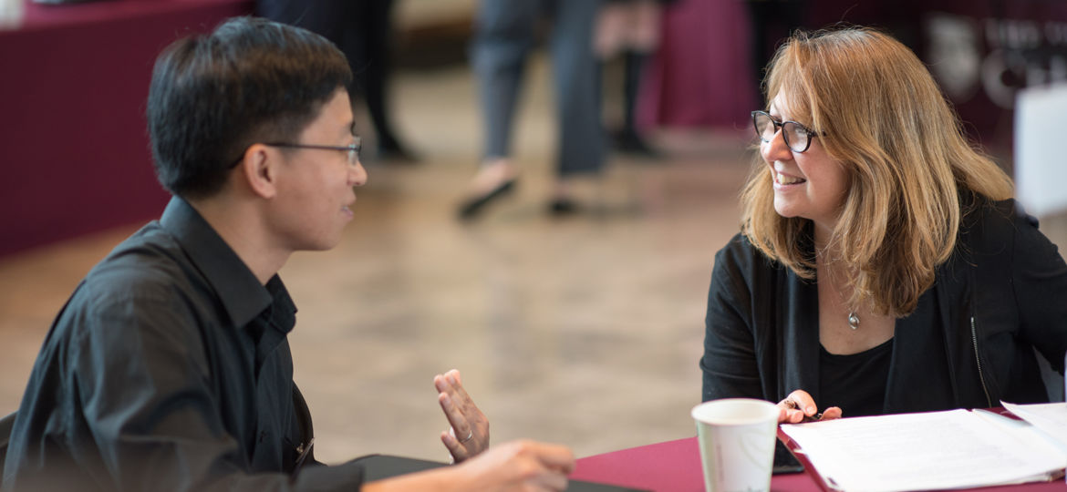 Two people talking at BSD Career Forum